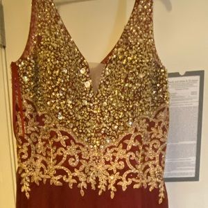 A burgundy and gold formal dress